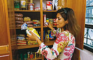 Woman looking at food storage
