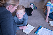 Mother and son reading scriptures