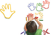 Illustration of a boy tracing his hands in crayon