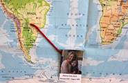 World map with picture of young girl and older woman pasted on