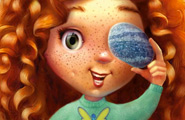 Red-headed girl holding a pebble up to her eye